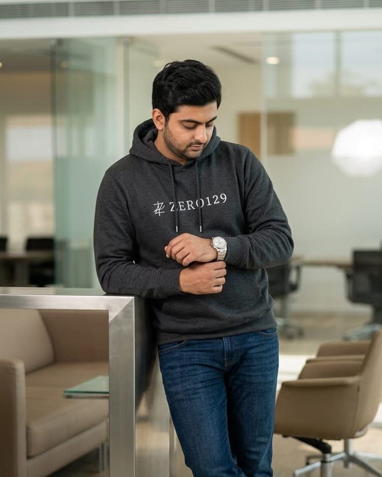 Shikhar Khurana in a charcoal Zero129 hoodie with the monogram wordmark